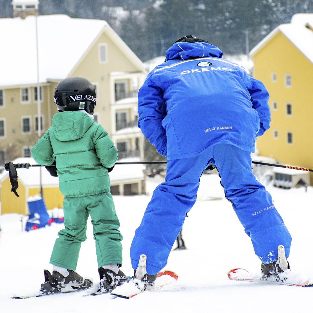 Showing the kids how to ski